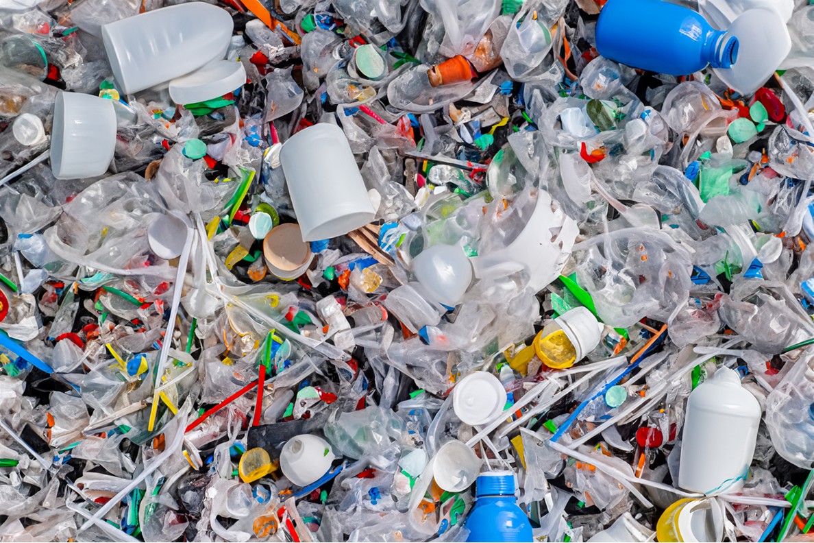 Pile of used plastic bottles, utensils, etc