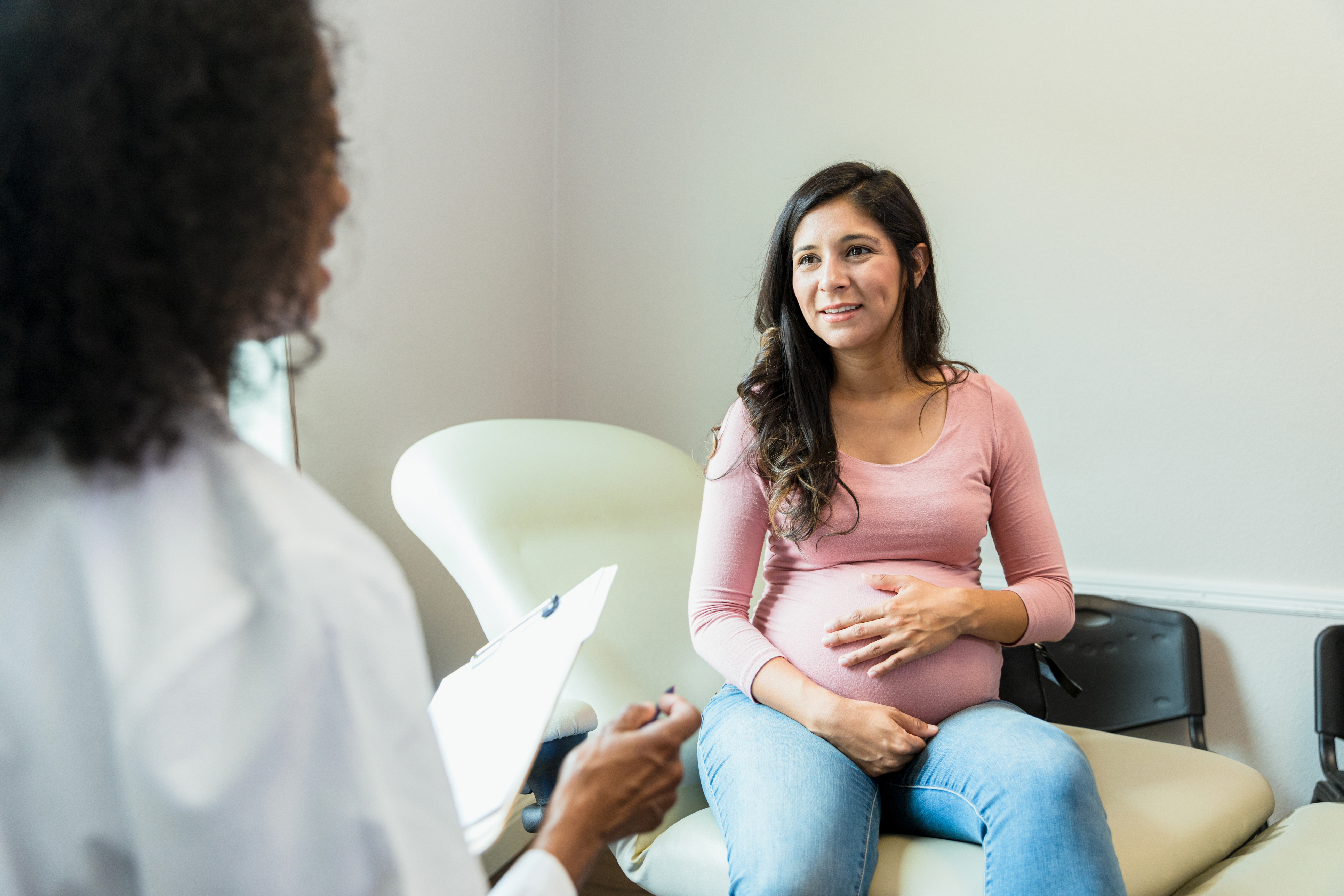 Pregnant woman with clinician