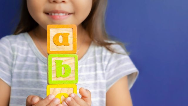 Child holding blocks