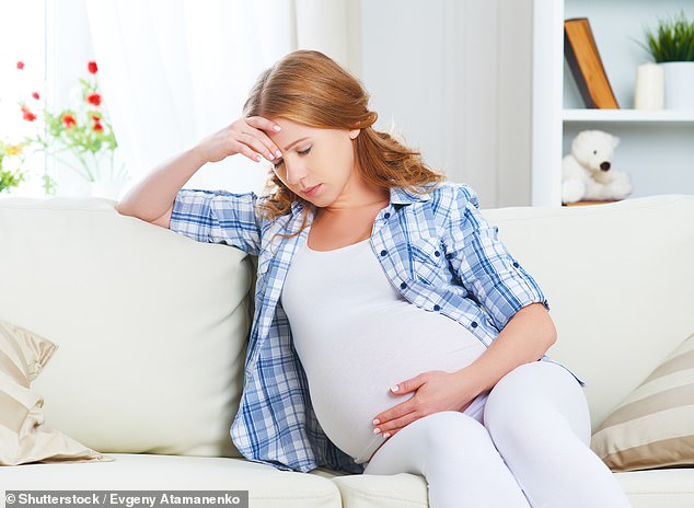 Pregnant woman looking worried