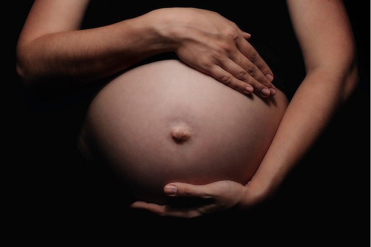 Hands on pregnant belly