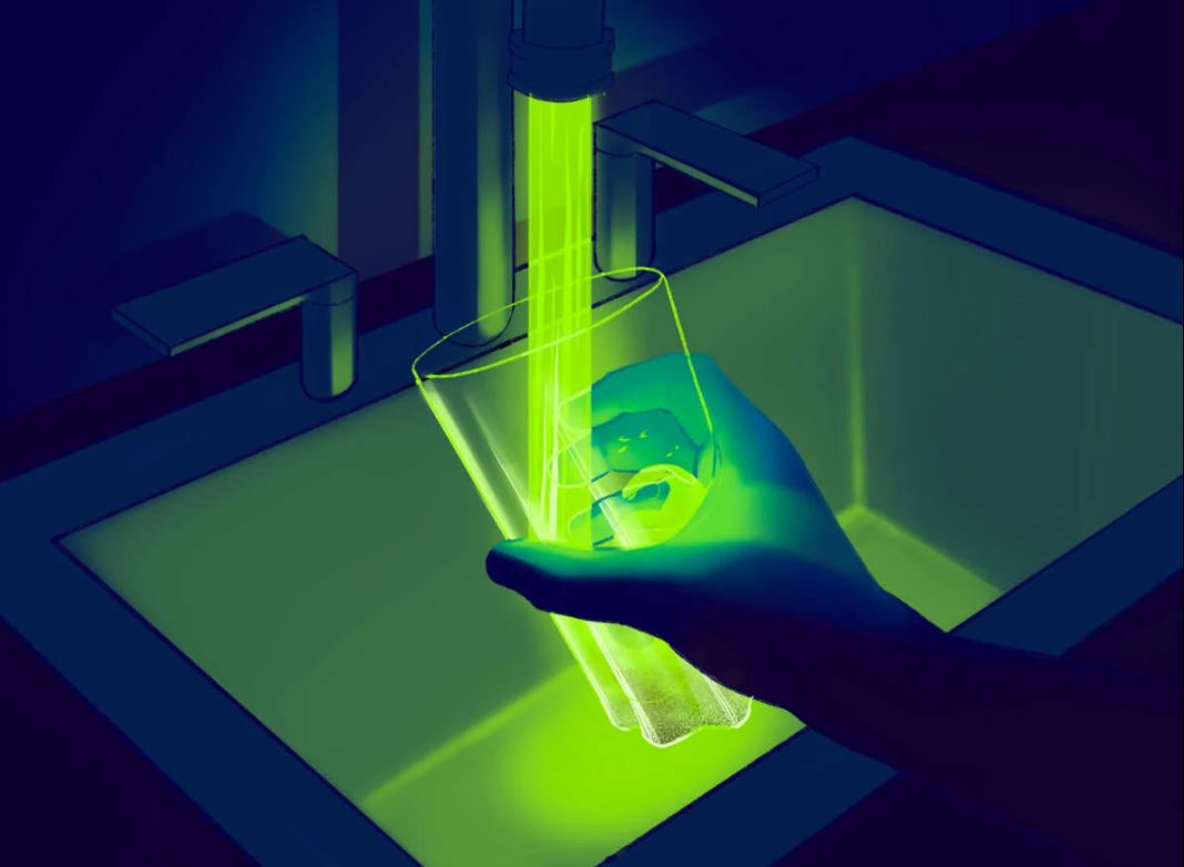 Glowing water flowing into water glass