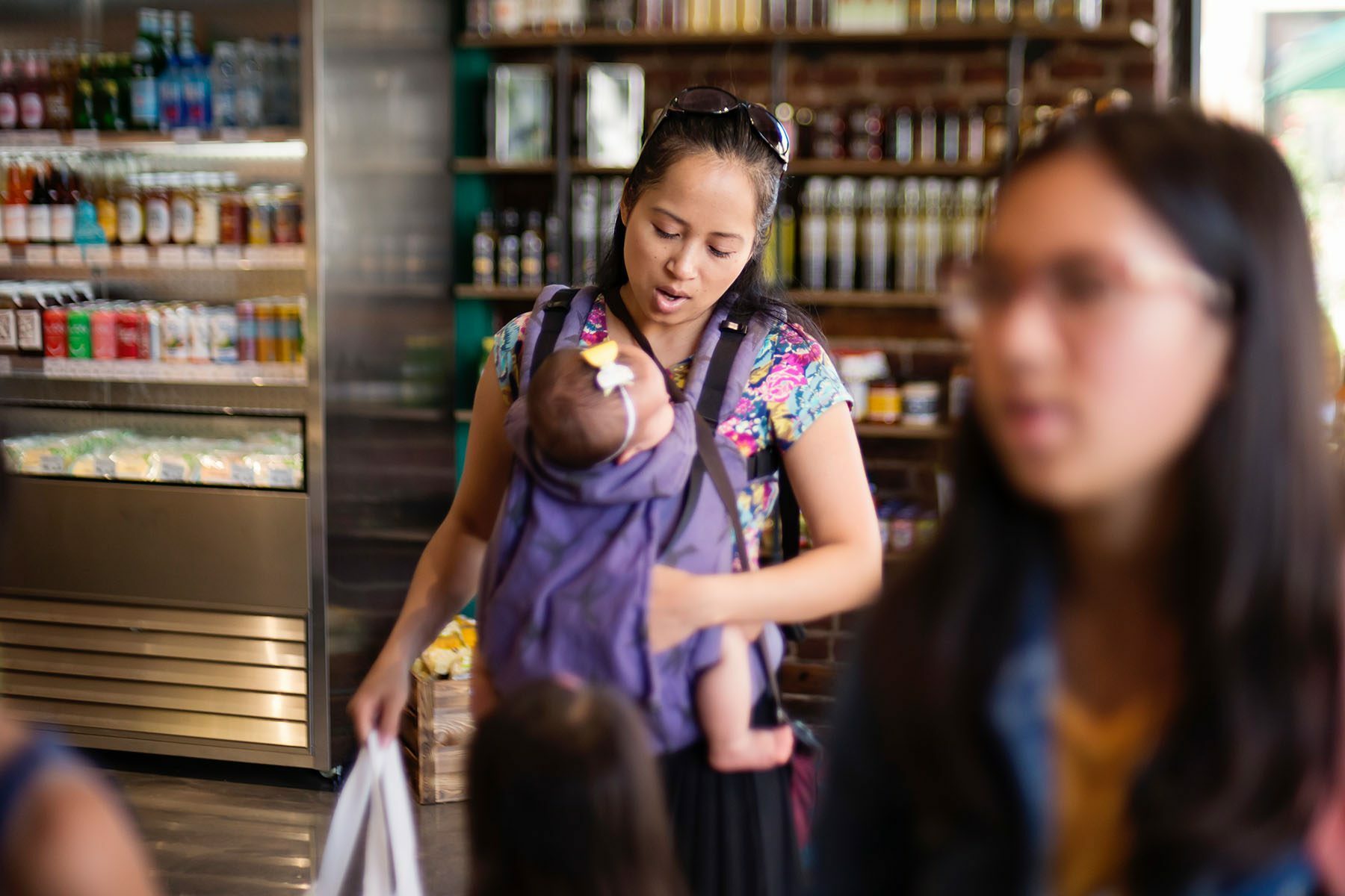 Woman with baby in carrier