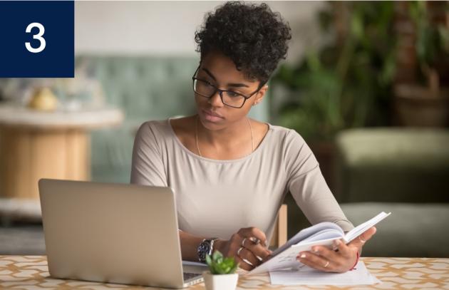 Woman using laptop for research