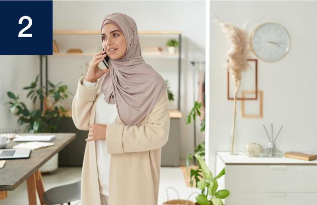 Woman in headscarf talking on phone