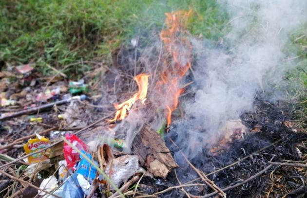 Burning trash in backyard