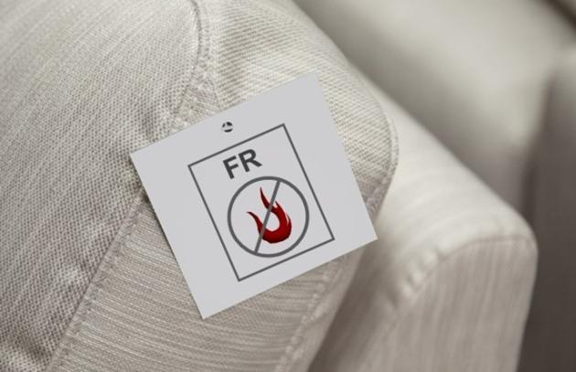 Couch with flame retardant tag on it