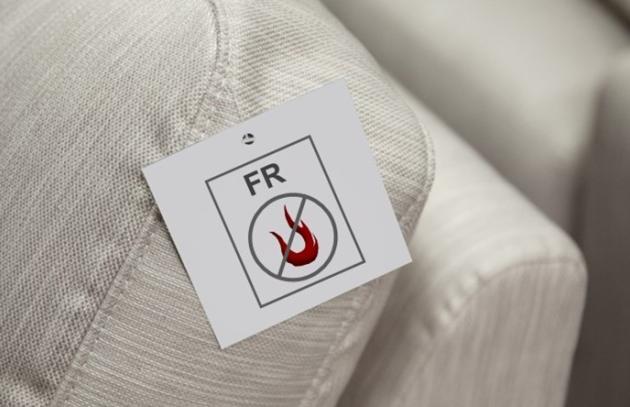 Couch with flame retardant tag on it