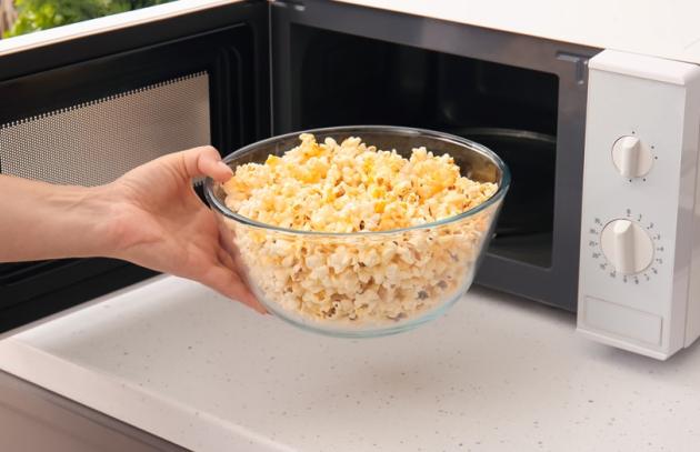 Popcorn heating in glass bowl in microwave