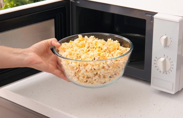 Popcorn heating in glass bowl in microwave