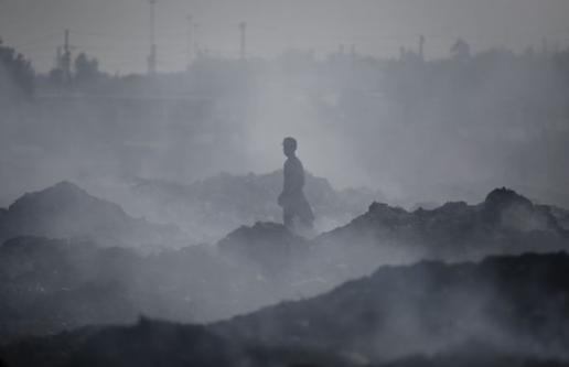 Worker stands in smoky environment