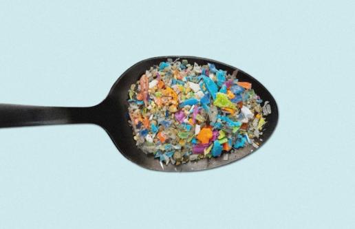 Spoon with microplastic particles in it