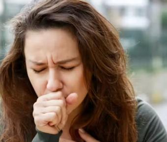 Woman coughing while exercising