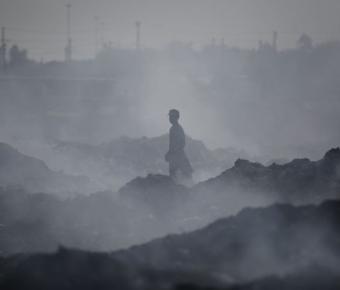 Worker stands in smoky environment