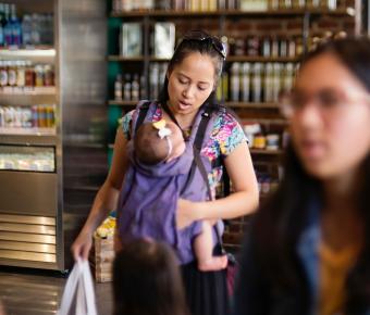 Woman with baby in carrier